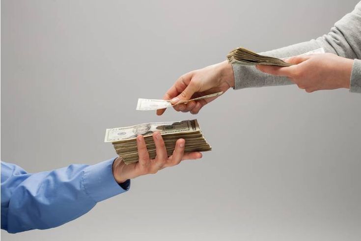 Hands exchanging money